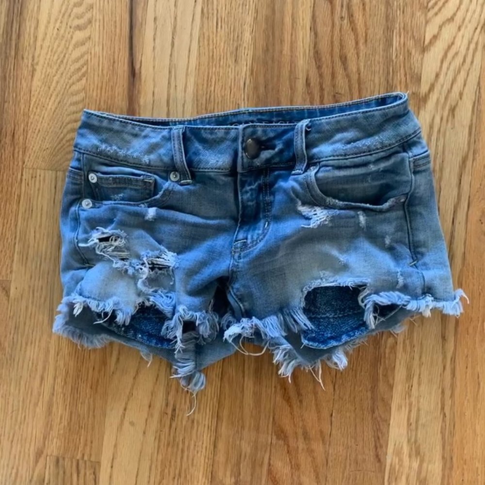 AE 360 super stretch shortie distressed shorts
